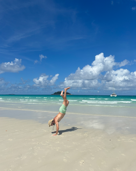 Seacret founder, Seacret, sustainable ocean brand, Whitehaven beach, Whitsundays, handstand